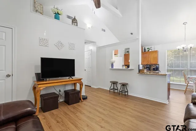 a living room with furniture and a flat screen tv