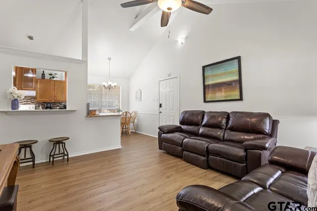 a living room with furniture and a large window