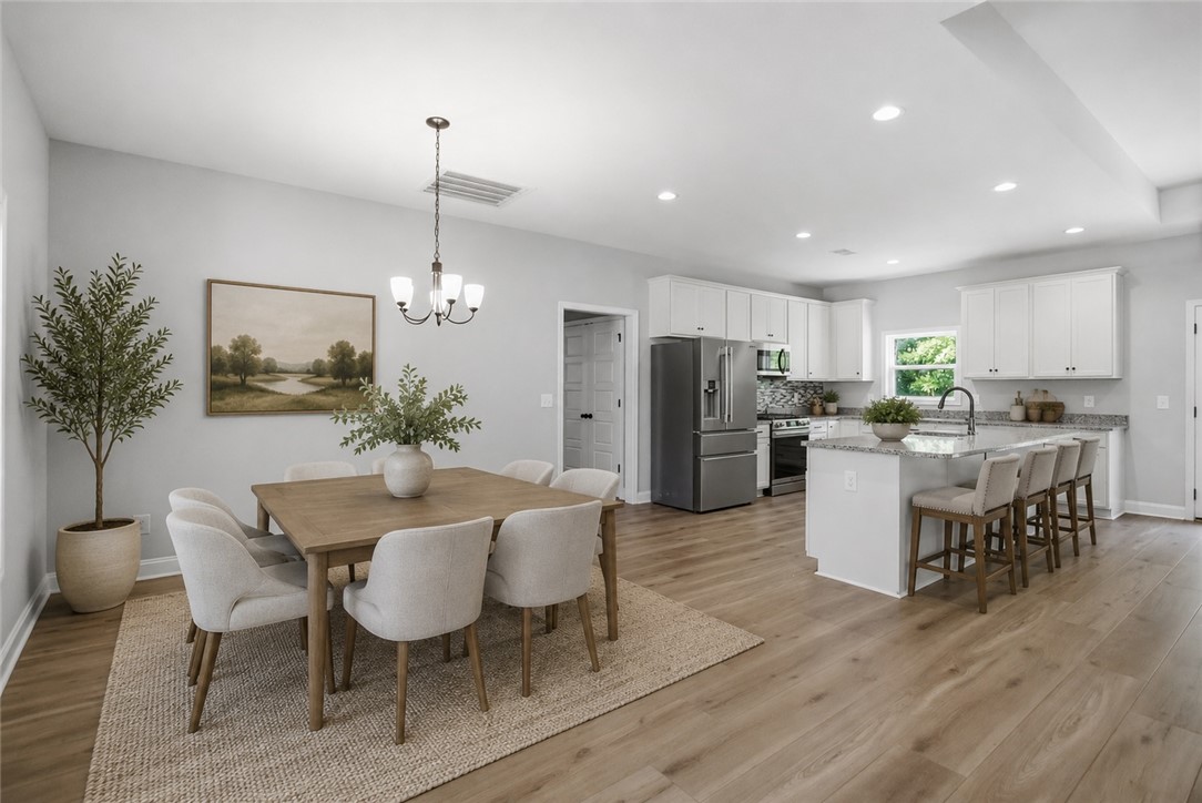 912 Watercrest Road West Union, SC 29696 - Photo 14 of 49 VIRTUALLY STAGED: Bright and airy, this open-concept kitchen and dining area provides a seamless flow for everyday living.