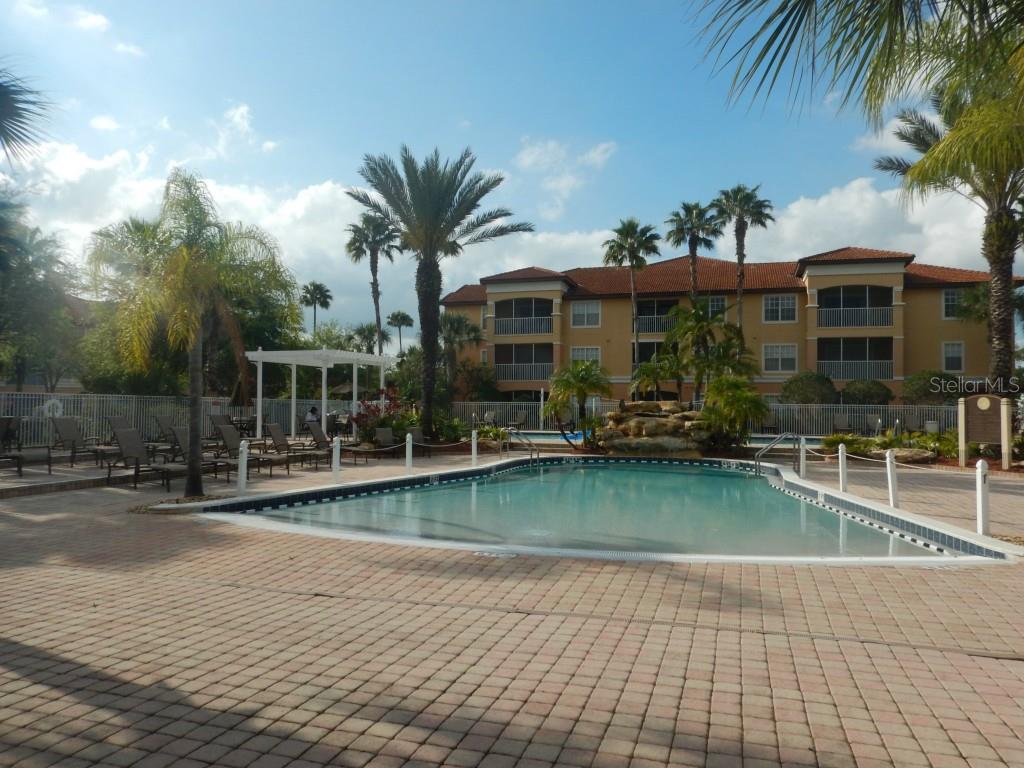 5479 Vineland Road, Unit 9202 Orlando, FL 32811 - Photo 1 of 1 a front view of a house with garden