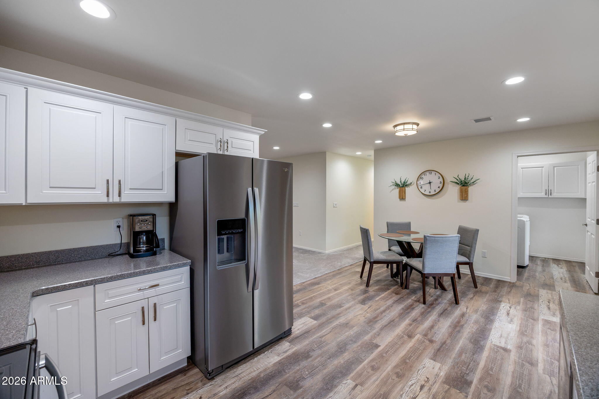 5145 Drifting Snow Loop Pinetop, AZ 85935 - Photo 12 of 37 a kitchen with white cabinets and stainless steel appliances