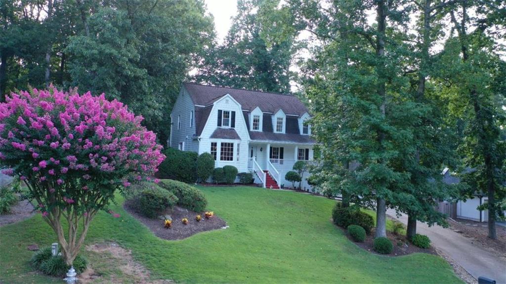 1235 Partridge Way Marietta, GA 30062 - Photo 1 of 1 a front view of a house with a yard and garden