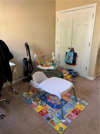 a room with gym equipment and a table