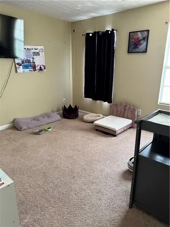 a bedroom with a bed and cabinets