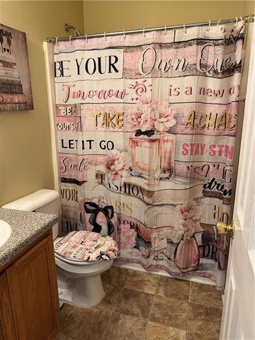 a bathroom with a toilet and a sink