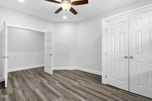 a large kitchen with stainless steel appliances granite countertop a stove a sink and a refrigerator