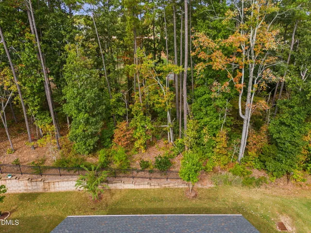 an aerial view of a house with a ocean view