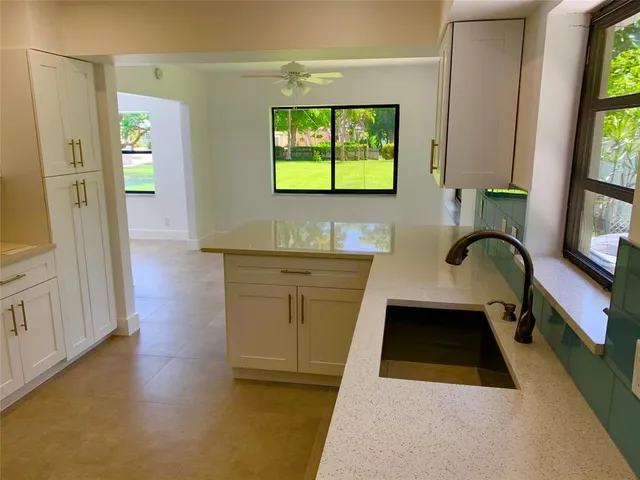 a bathroom with a sink a vanity and a mirror