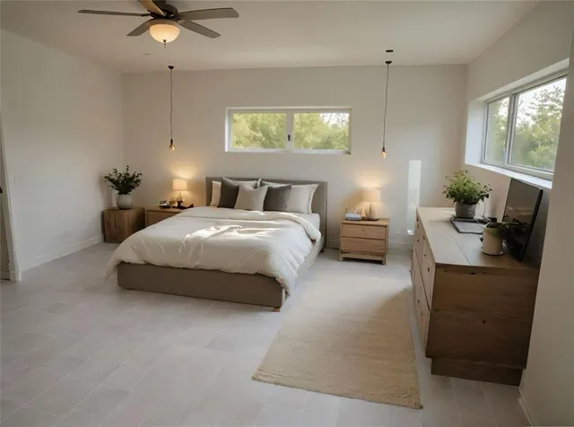 a bedroom with a bed and window