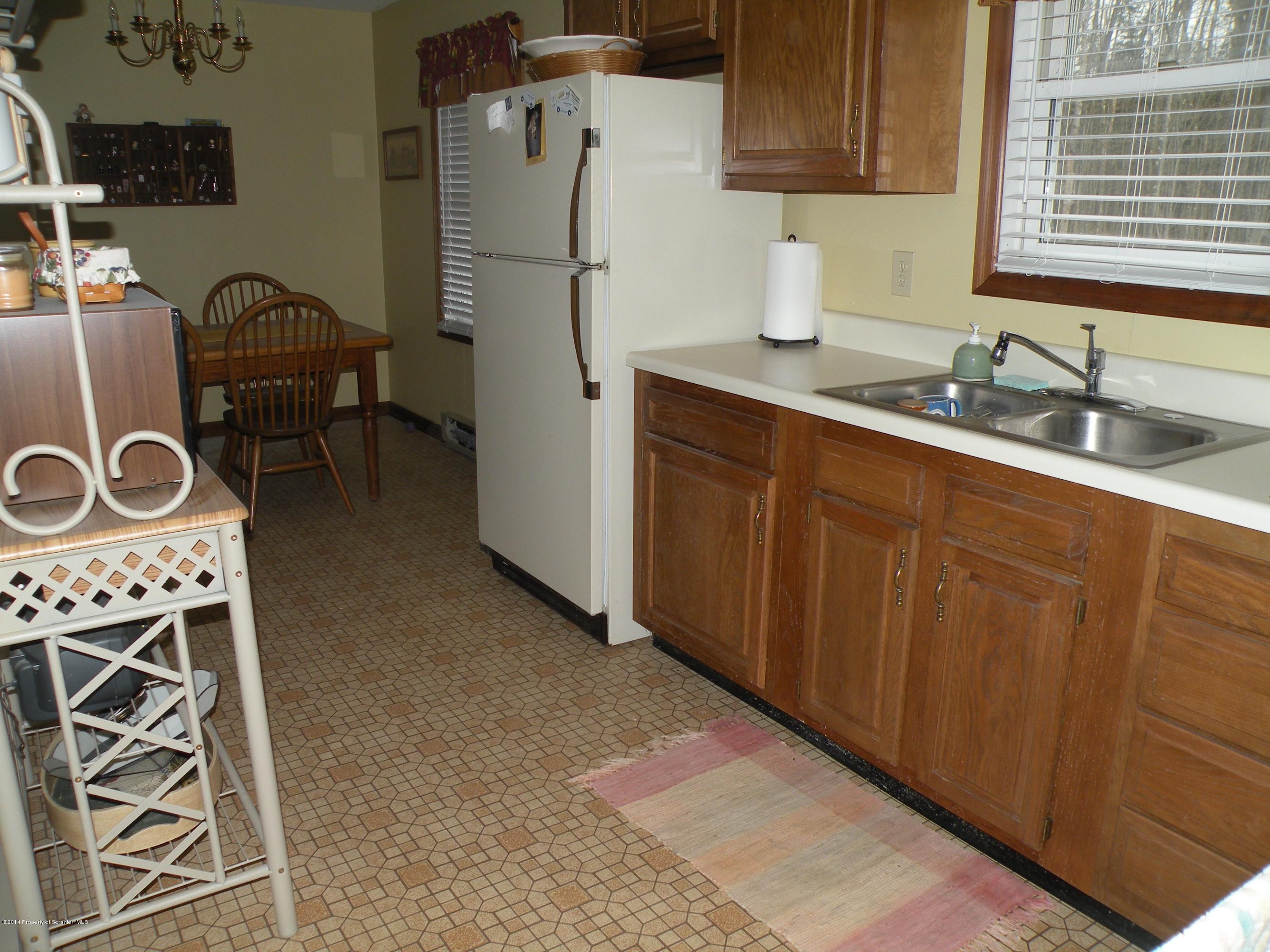 3381 Le Raysville Road Rome, PA 18837 - Photo 18 of 30 a kitchen with stainless steel appliances granite countertop a refrigerator and a sink