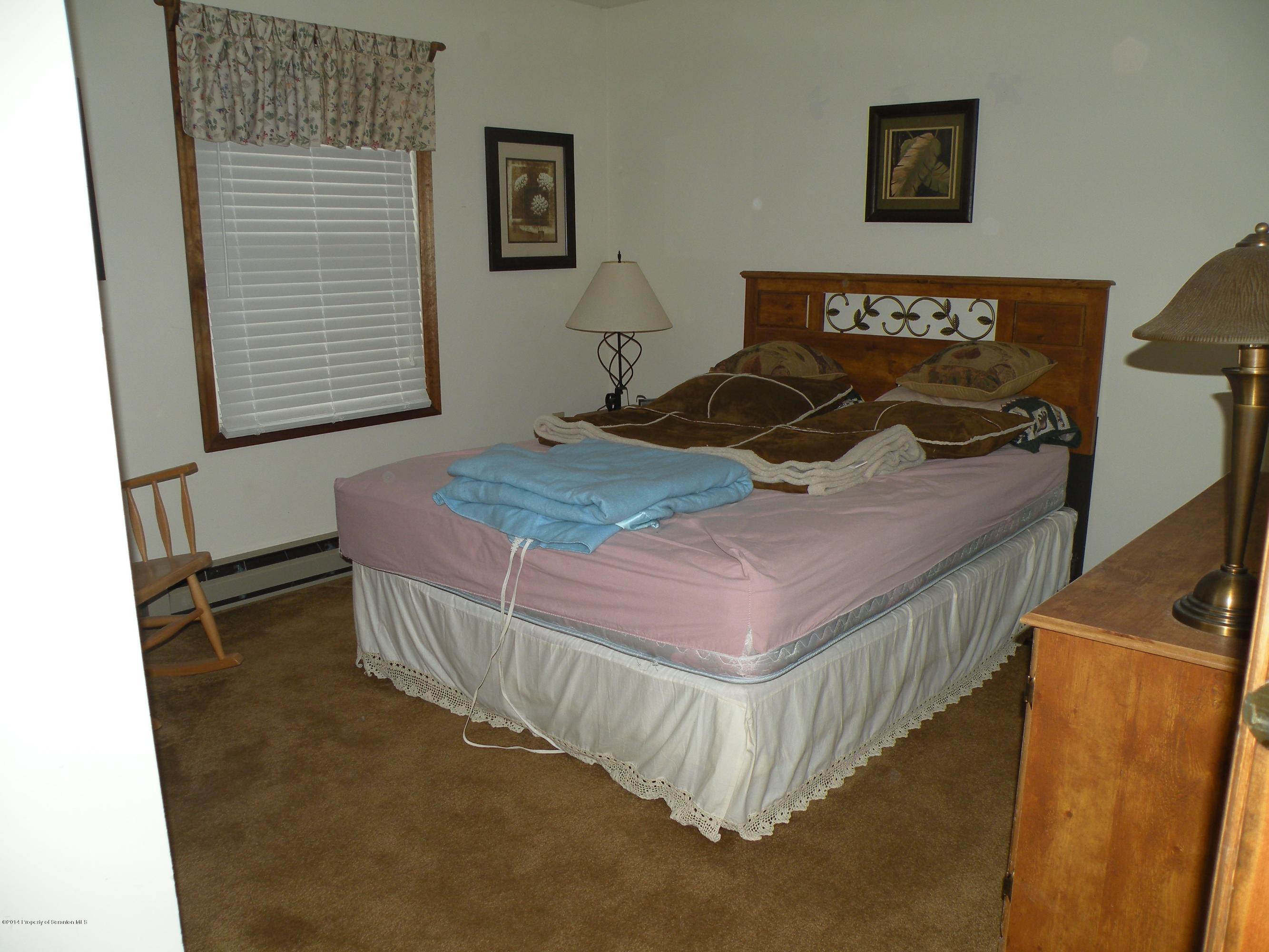 3381 Le Raysville Road Rome, PA 18837 - Photo 19 of 30 a bed sitting in a bedroom next to a window