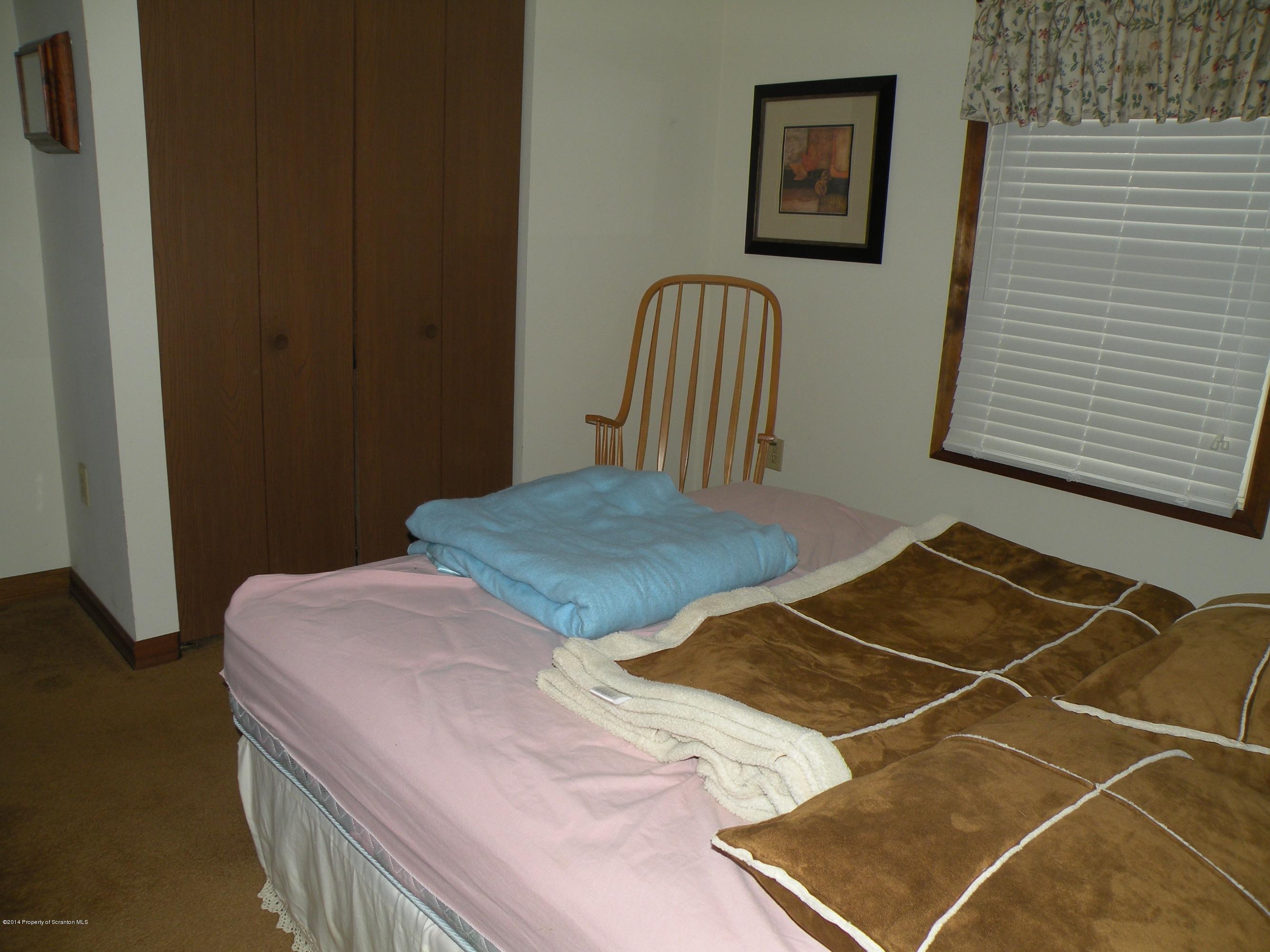 3381 Le Raysville Road Rome, PA 18837 - Photo 20 of 30 a bedroom with a bed and a window