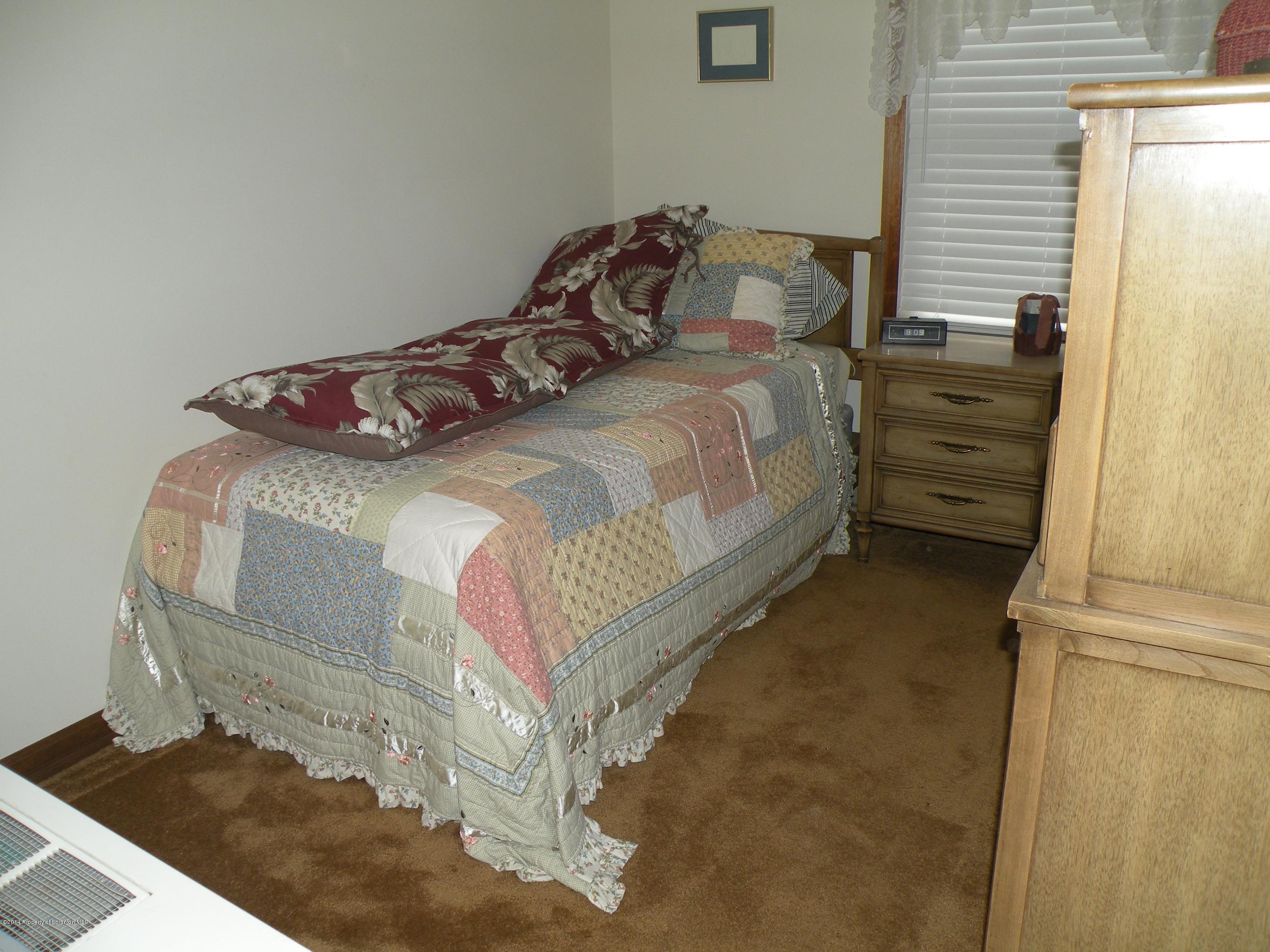 3381 Le Raysville Road Rome, PA 18837 - Photo 23 of 30 a bedroom with a bed and a window