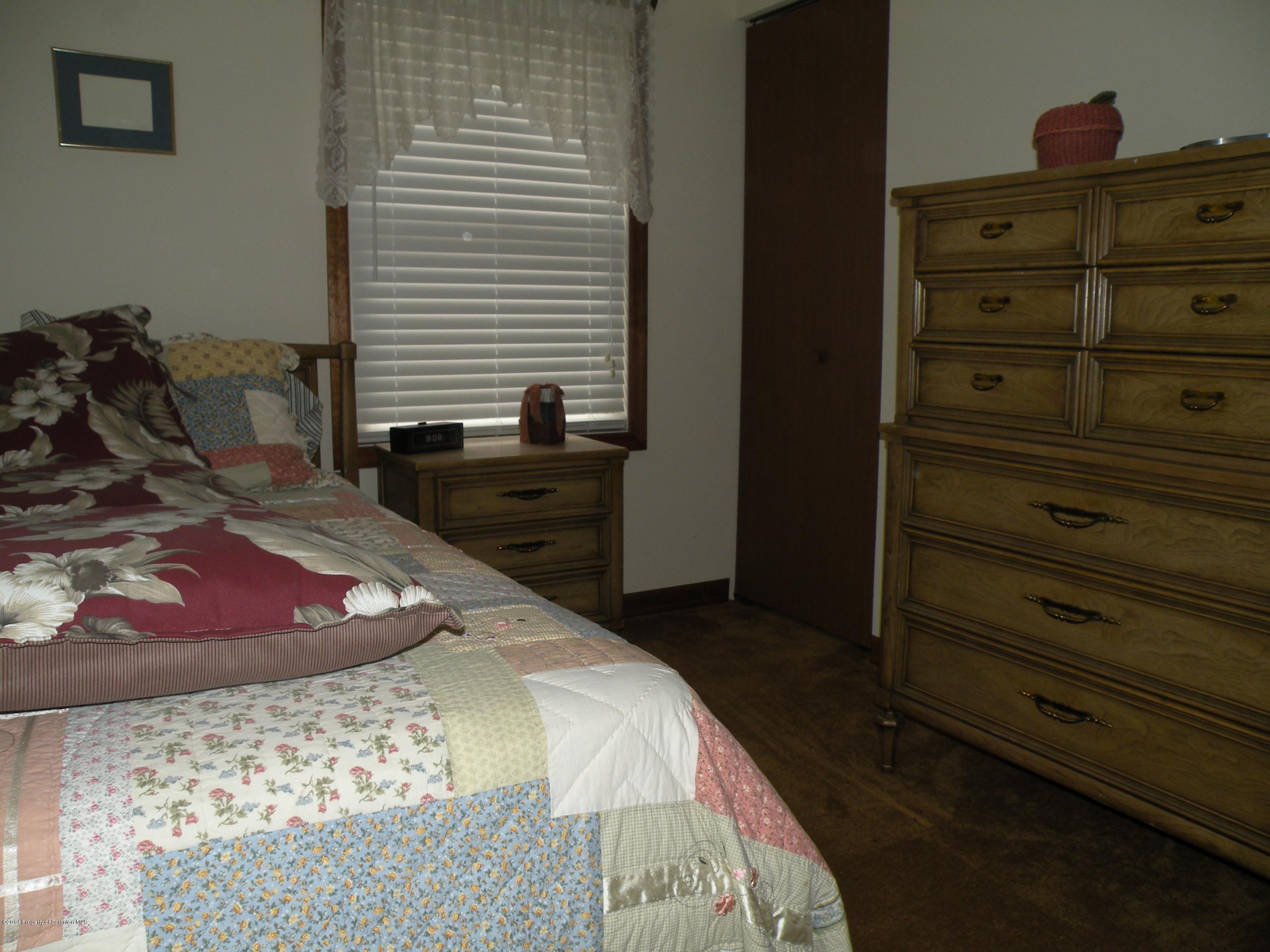 3381 Le Raysville Road Rome, PA 18837 - Photo 24 of 30 a bedroom with a bed and a dresser