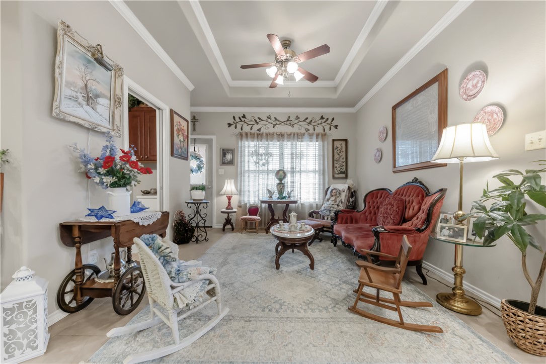 3815 Harvey Road College Station, TX 77845 - Photo 15 of 24 Living area with a raised ceiling, ceiling fan, an