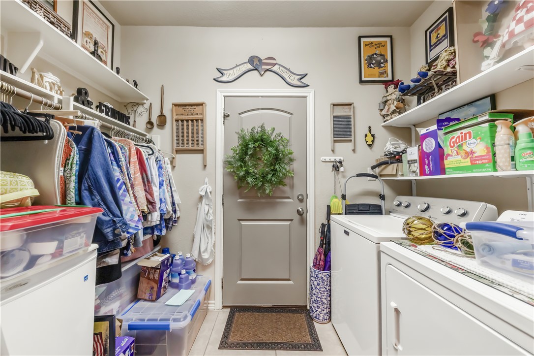 3815 Harvey Road College Station, TX 77845 - Photo 16 of 24 Laundry room with washing machine and clothes drye