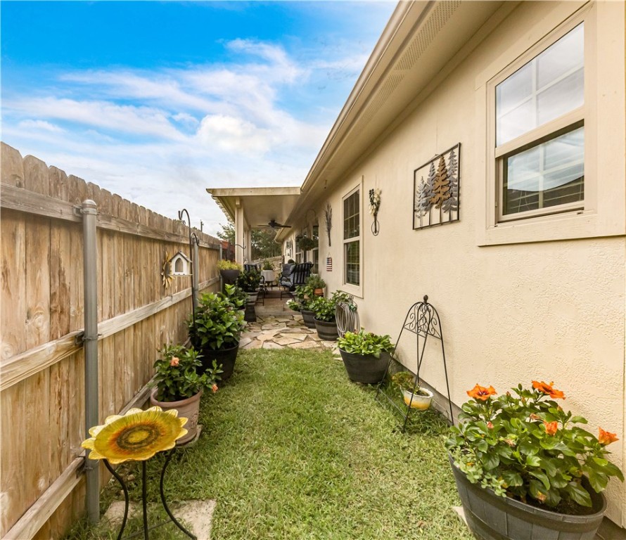 3815 Harvey Road College Station, TX 77845 - Photo 21 of 24 Fenced backyard featuring ceiling fan and a patio