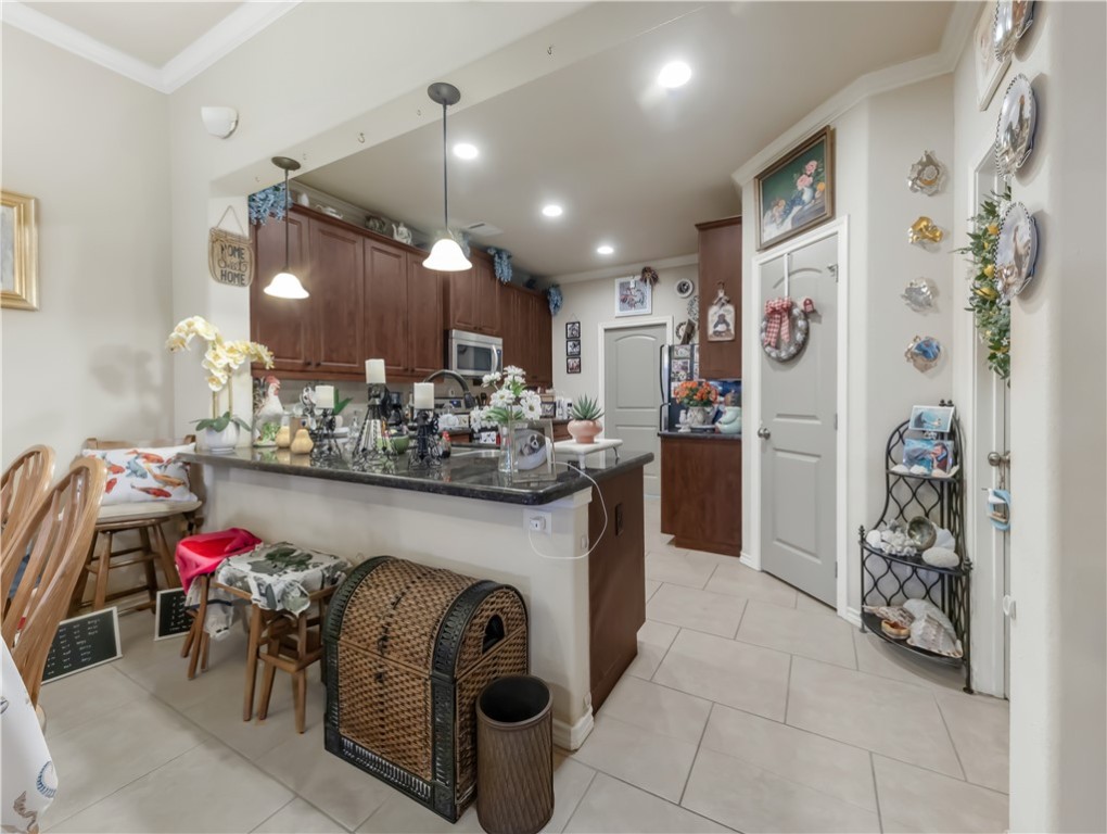 3815 Harvey Road College Station, TX 77845 - Photo 10 of 24 Kitchen featuring stainless steel microwave, ornam