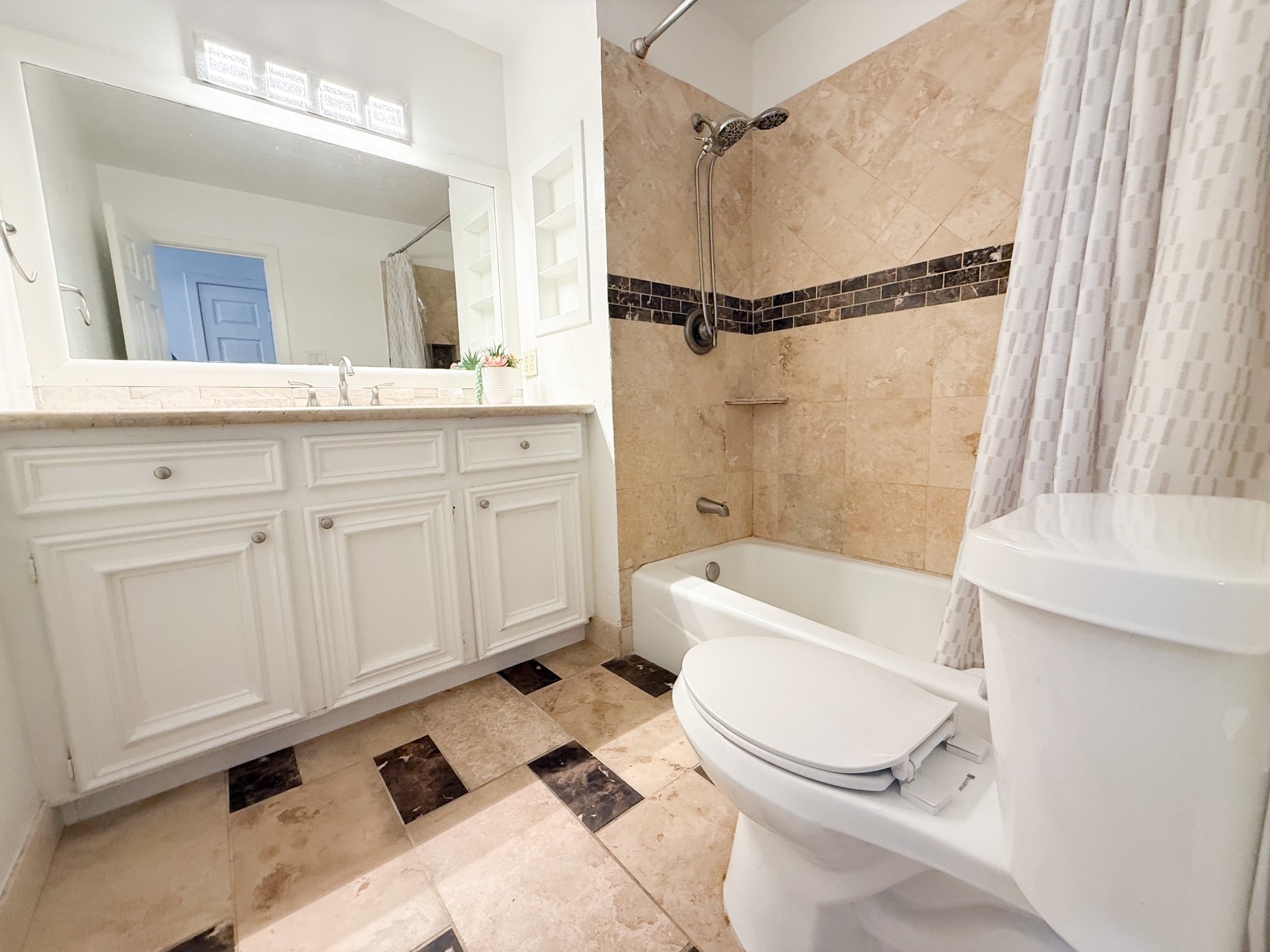 124 Bluebird Lane Pasadena, TX 77502 - Photo 19 of 25 a bathroom with a sink a toilet and a bathtub
