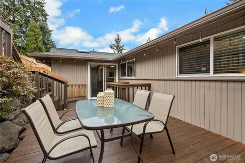 a view of a patio with a table and chairs