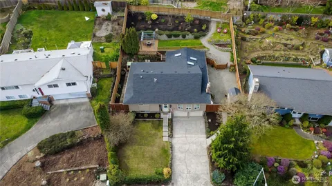 an aerial view of a house with a garden