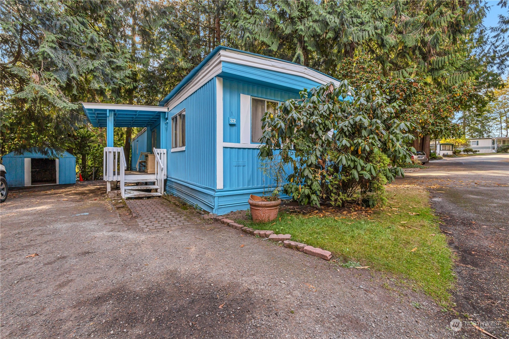 1729 Southeast 194th Street, Unit 32 Bothell, WA 98012 - Photo 1 of 19 a view of a house with backyard and trees