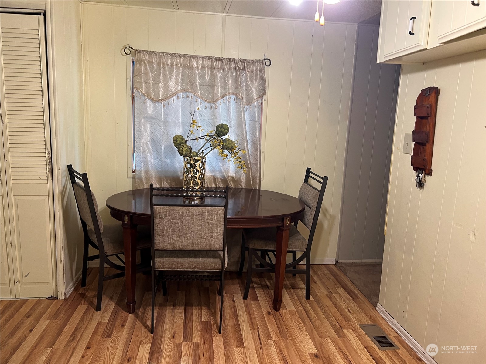 1729 Southeast 194th Street, Unit 32 Bothell, WA 98012 - Photo 13 of 19 a dining room with furniture and wooden floor