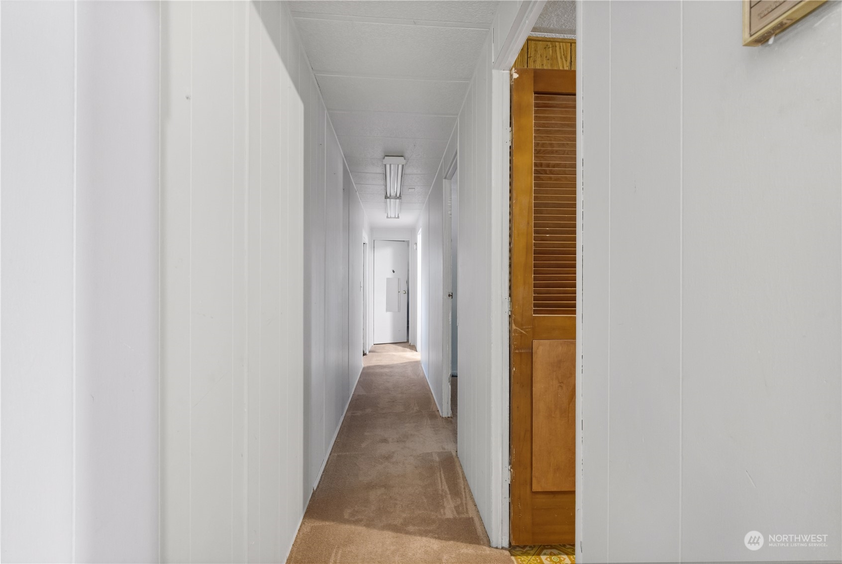 1729 Southeast 194th Street, Unit 32 Bothell, WA 98012 - Photo 14 of 19 a view of a hallway with windows