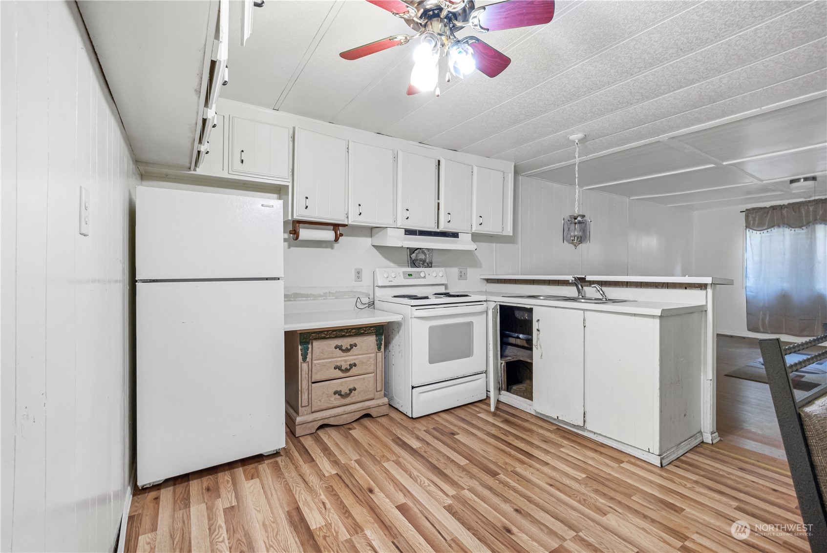 1729 Southeast 194th Street, Unit 32 Bothell, WA 98012 - Photo 5 of 19 a kitchen with stainless steel appliances a refrigerator sink and cabinets
