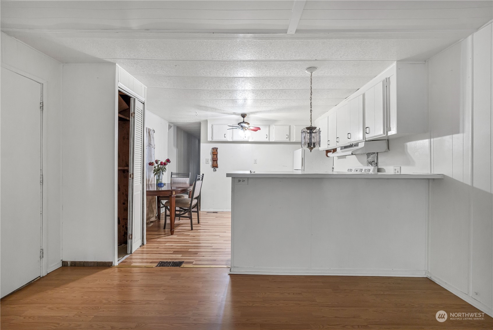 1729 Southeast 194th Street, Unit 32 Bothell, WA 98012 - Photo 6 of 19 a kitchen with kitchen island a counter top space and a view of living room