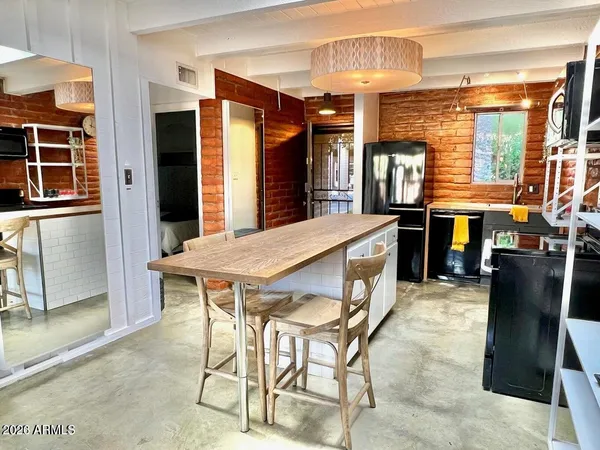 a dining room with furniture and window