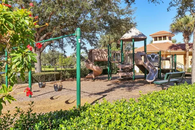 a view of a park with sitting area