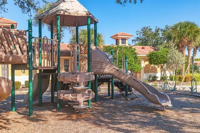 a view of a house with yard and sitting area