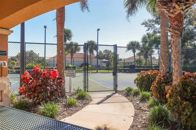 a view of a pathway both side of a house
