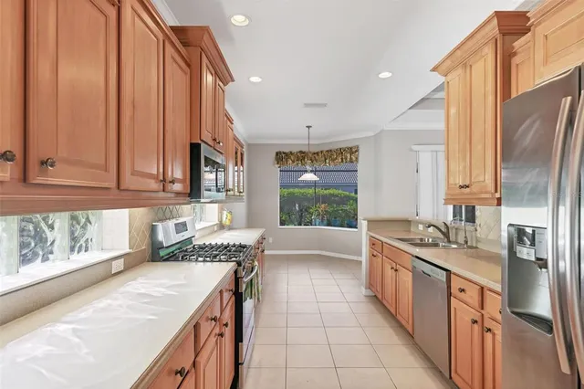 a kitchen with a sink stove and cabinets