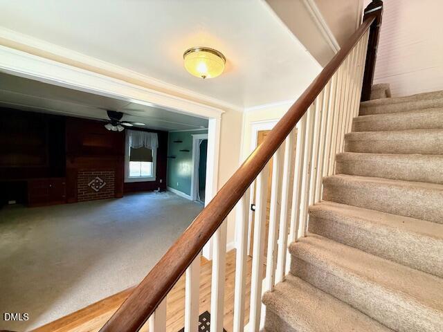 132 Buffalo Road Clarksville, VA 23927 - Photo 19 of 56 a view of staircase with lots of frames on wall and a large window