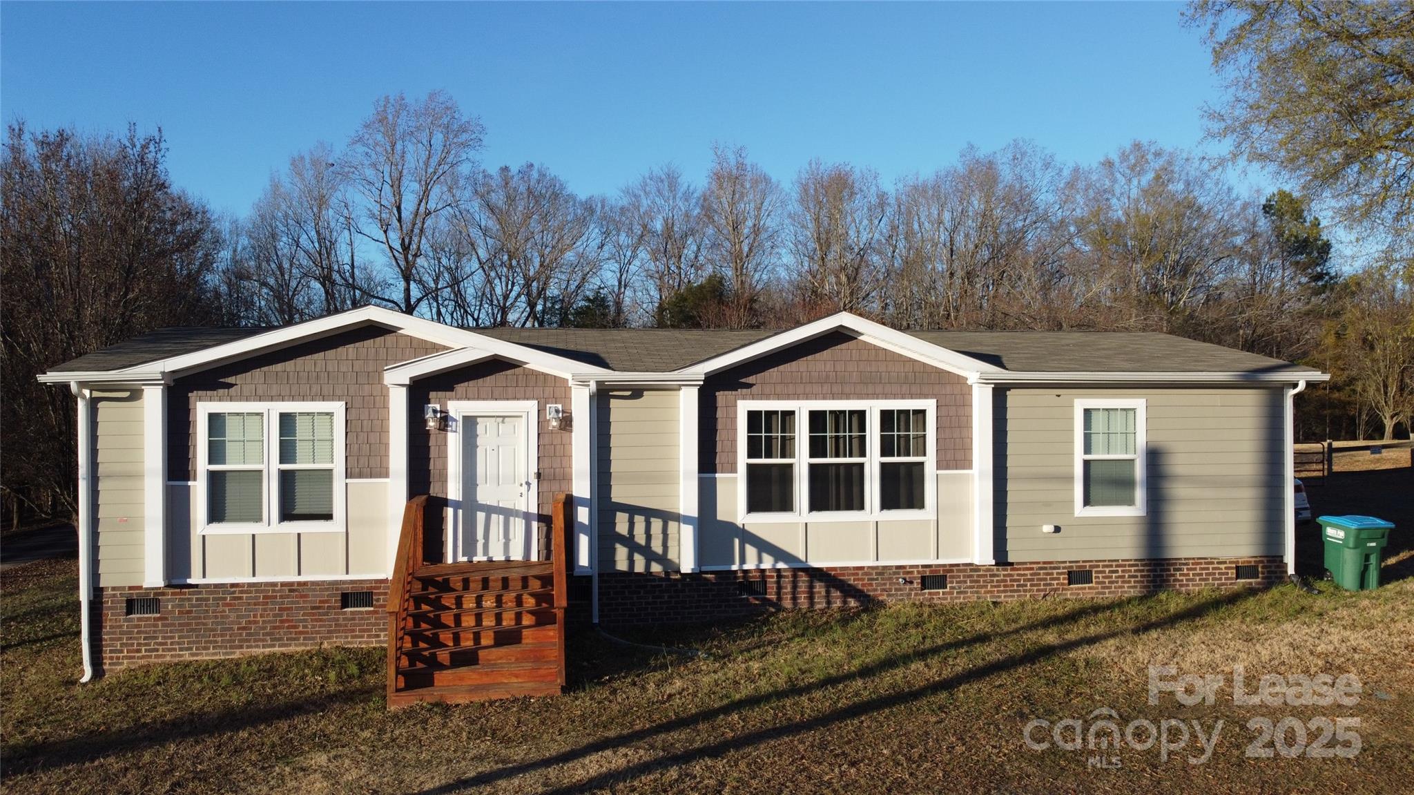 7708 Waxhaw Highway Waxhaw, NC 28173 - Photo 1 of 28 a front view of a house with a yard