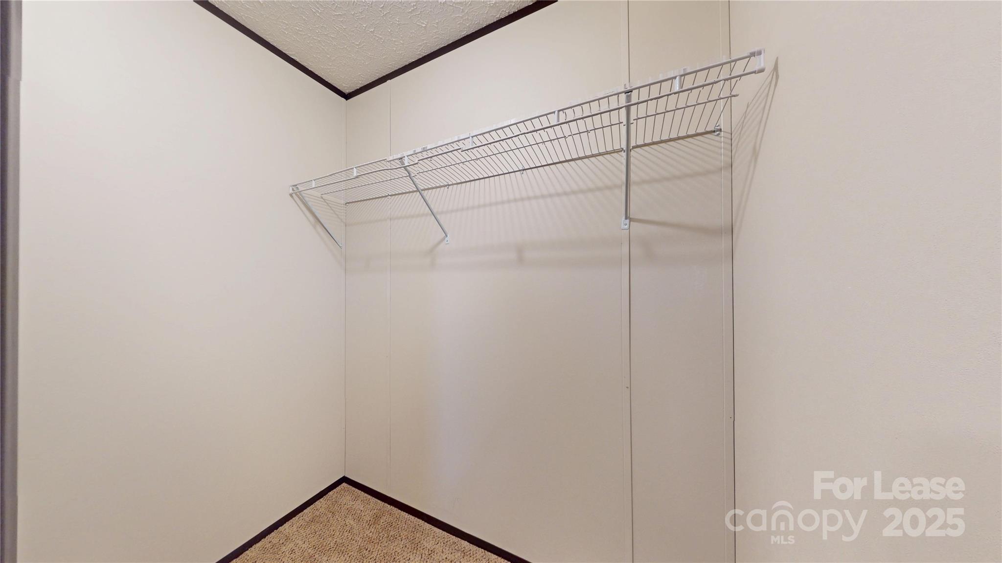 7708 Waxhaw Highway Waxhaw, NC 28173 - Photo 19 of 28 a view of a room with racks on the wall