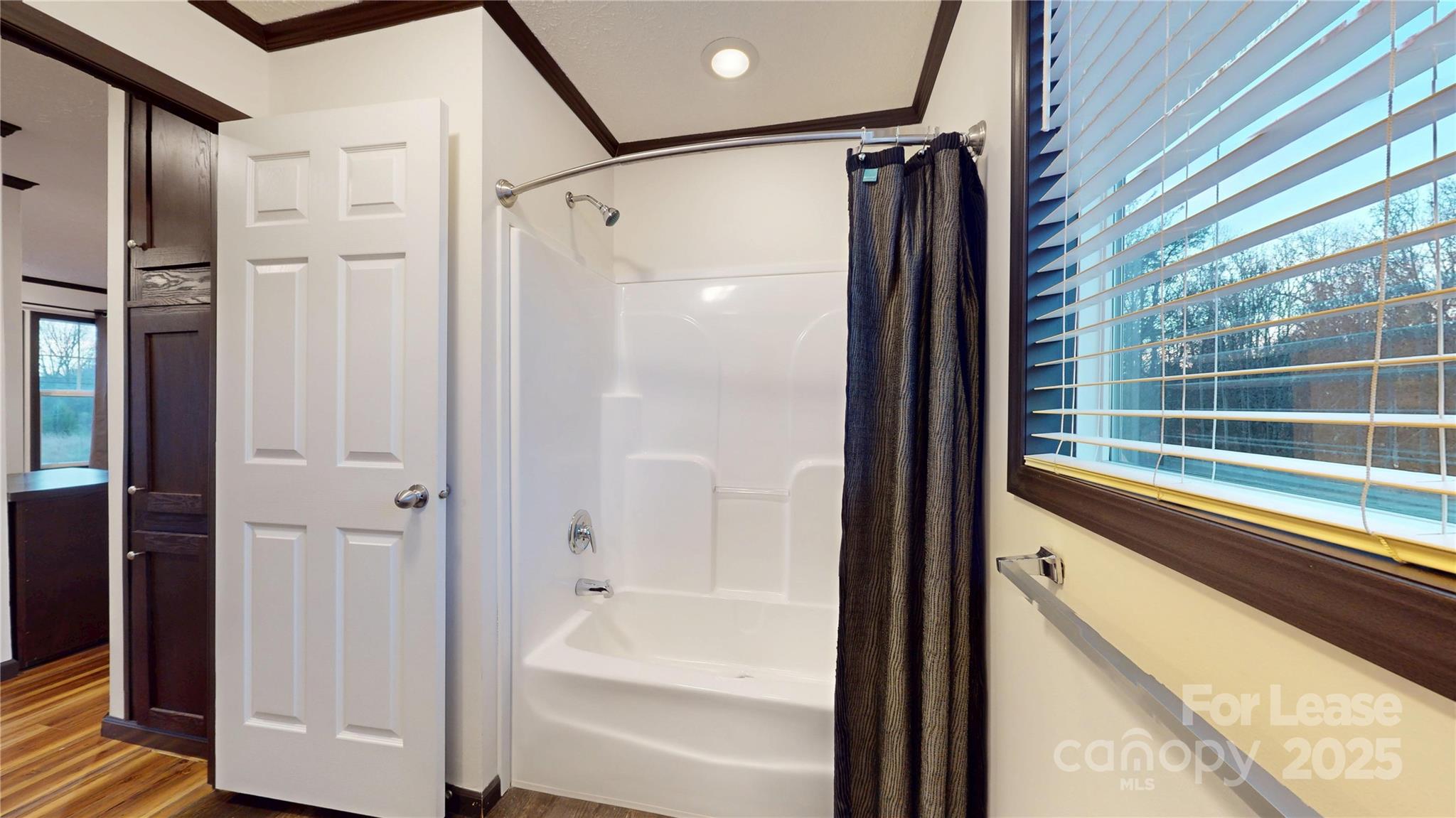 7708 Waxhaw Highway Waxhaw, NC 28173 - Photo 21 of 28 a bathroom with a bathtub and a shower