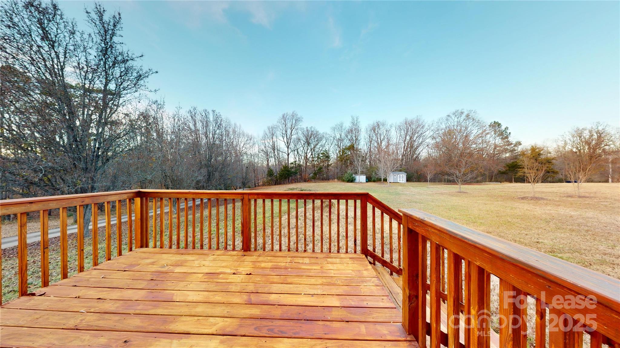 7708 Waxhaw Highway Waxhaw, NC 28173 - Photo 24 of 28 a view of deck and yard with trees in the background