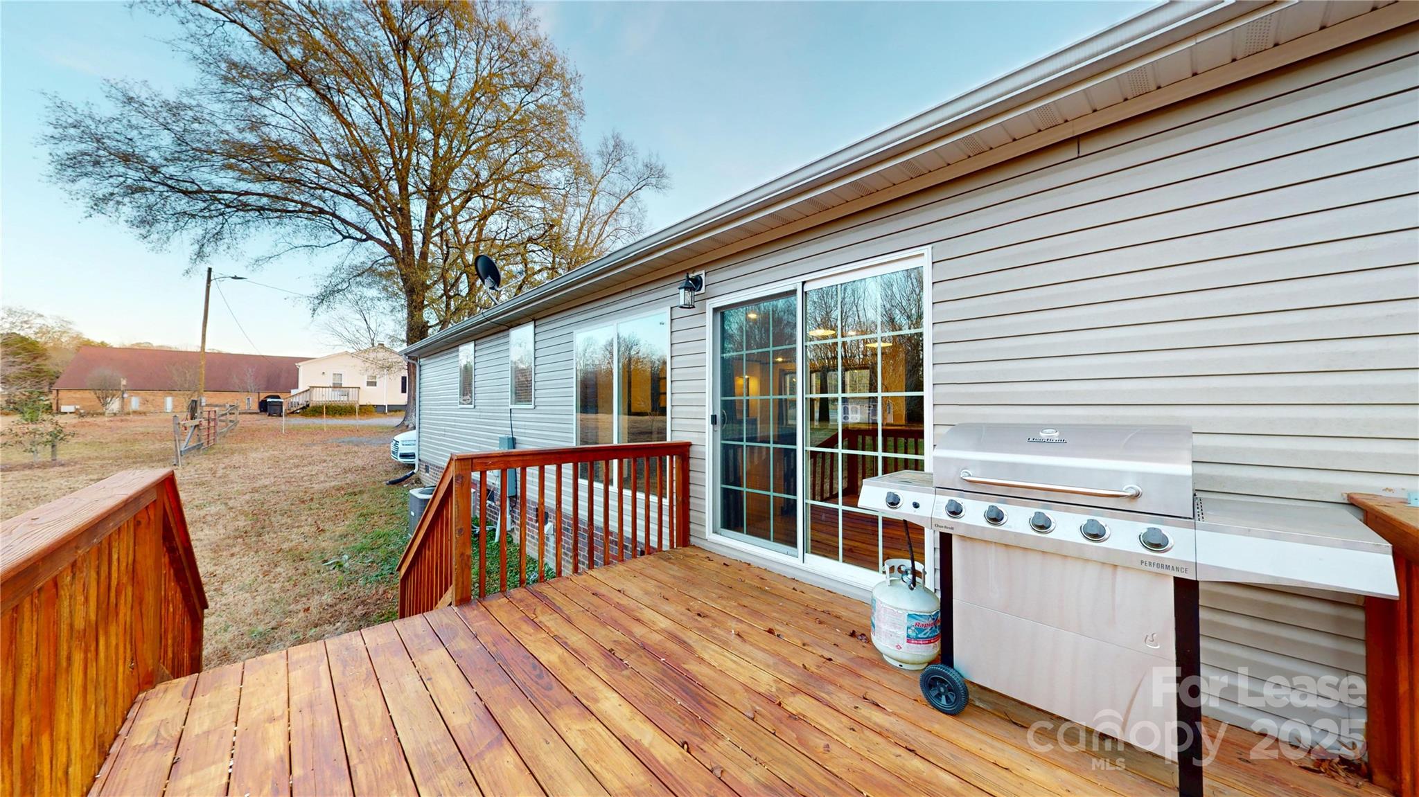7708 Waxhaw Highway Waxhaw, NC 28173 - Photo 25 of 28 a view of outdoor space with deck and large trees