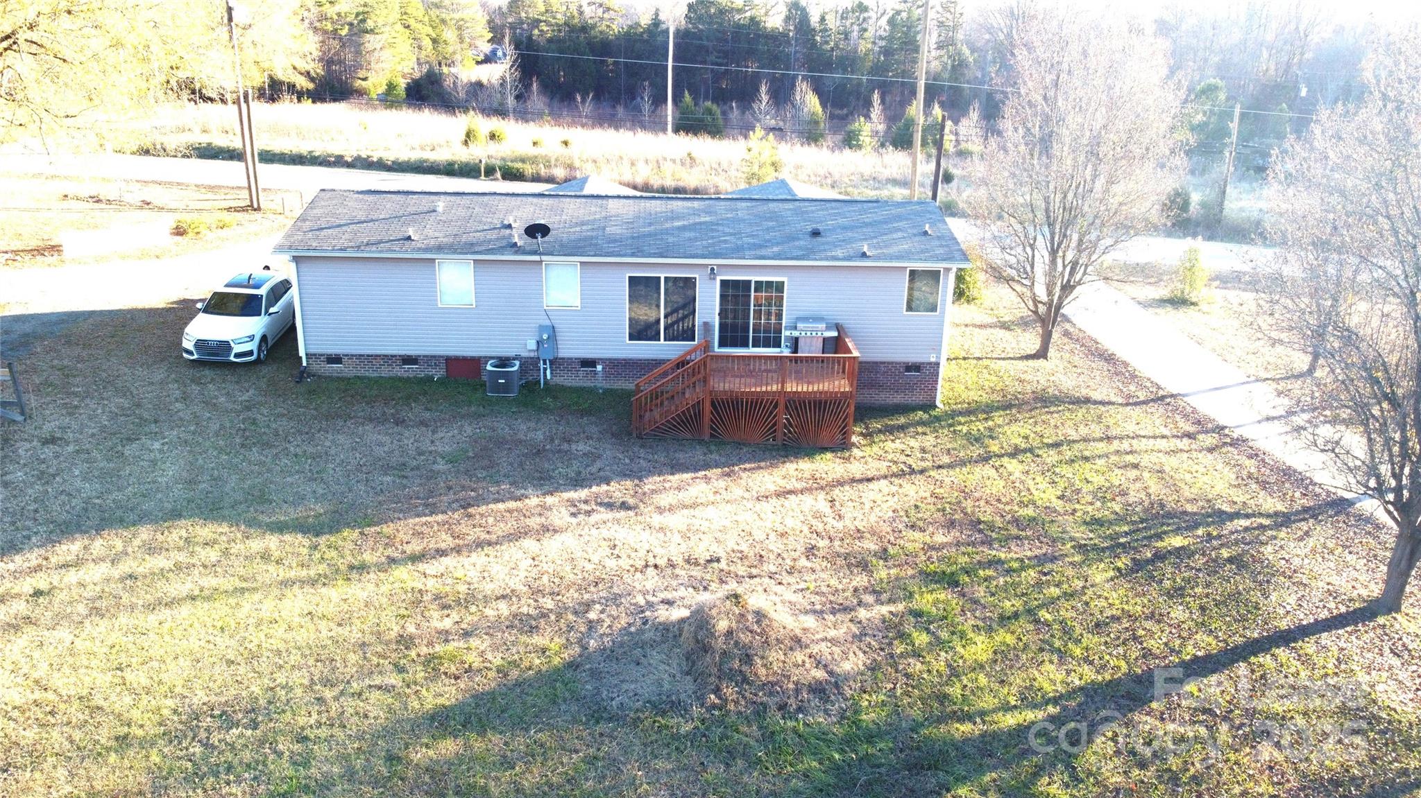 7708 Waxhaw Highway Waxhaw, NC 28173 - Photo 27 of 28 a view of a house with a yard and sitting area