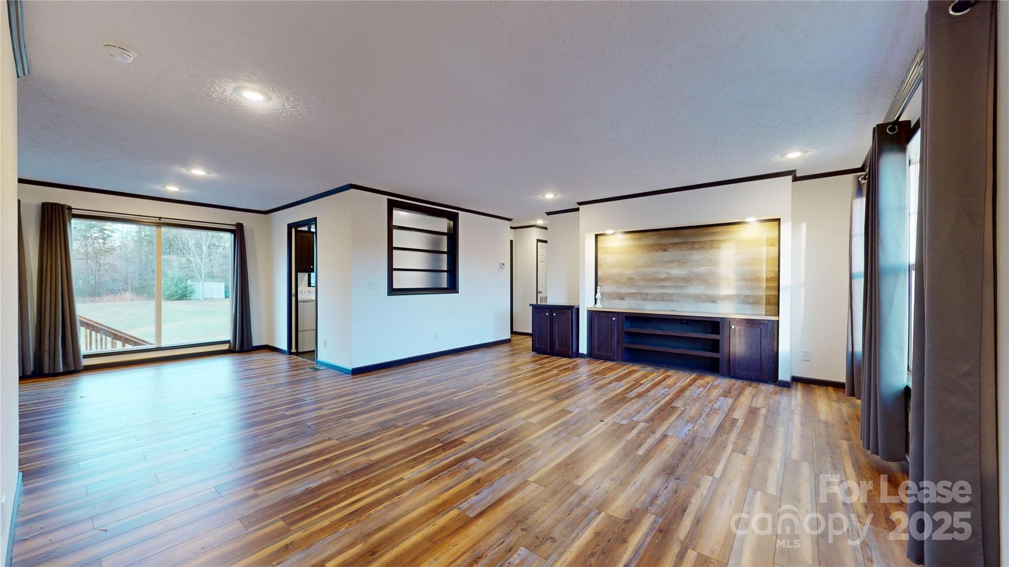 7708 Waxhaw Highway Waxhaw, NC 28173 - Photo 3 of 28 a view of livingroom with hardwood floor and hallway