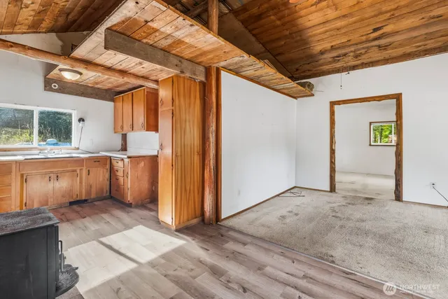 a bathroom with a granite countertop sink a mirror and a window