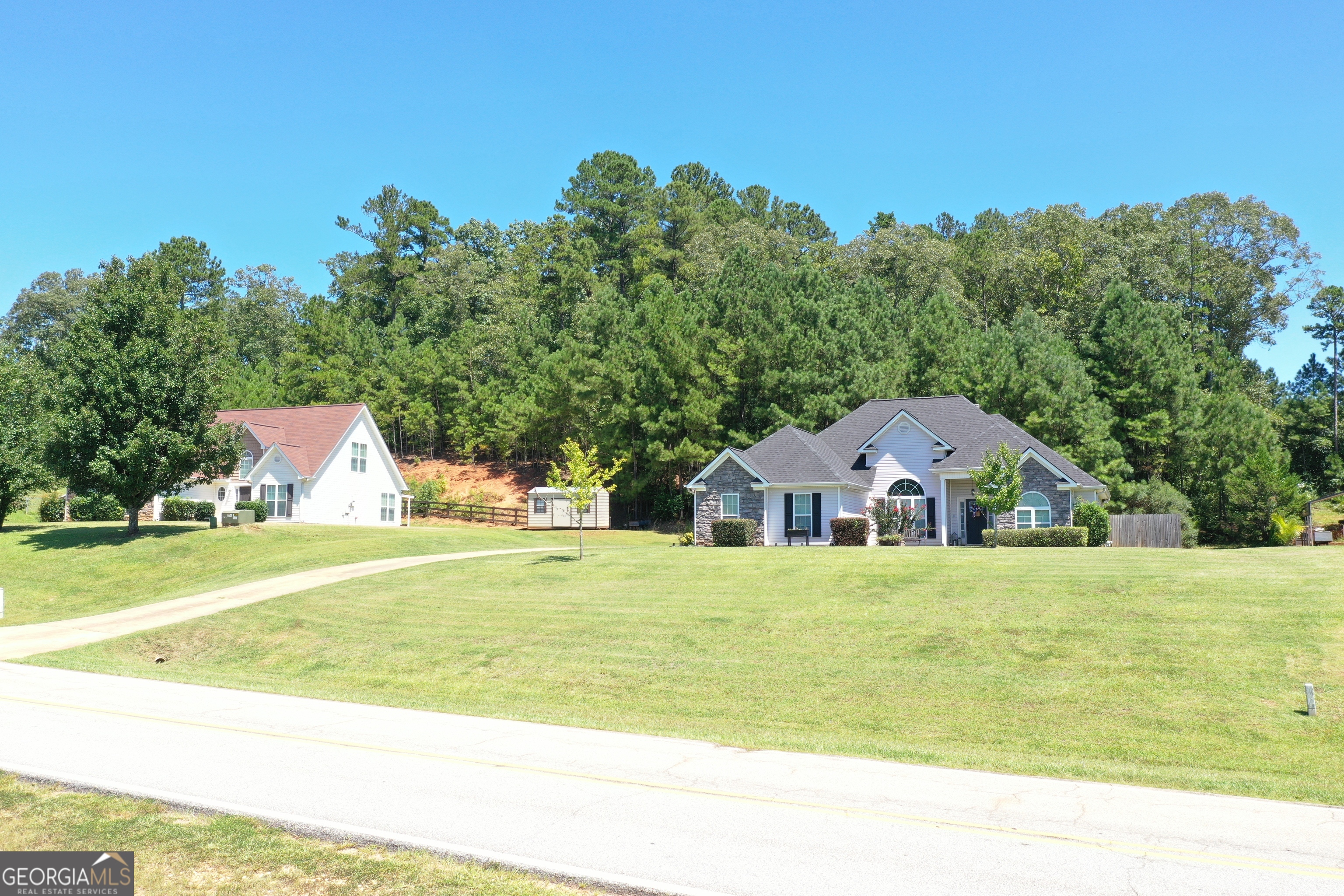 229 John Lovelace Road LaGrange, GA 30241 - Photo 49 of 59 a front view of a house with a garden
