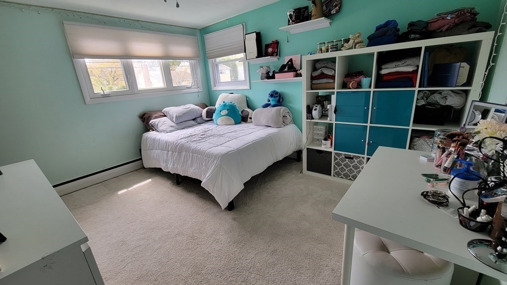 185 Evelyn Road Needham, MA 02494 - Photo 14 of 23 a bedroom with a bed and a window