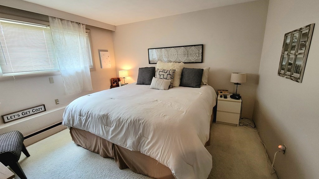 185 Evelyn Road Needham, MA 02494 - Photo 15 of 23 a bed sitting in a bedroom next to a window