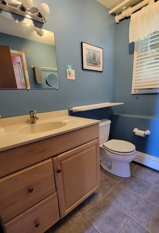 185 Evelyn Road Needham, MA 02494 - Photo 16 of 23 a bathroom with a toilet a sink and mirror