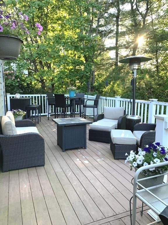 185 Evelyn Road Needham, MA 02494 - Photo 19 of 23 a balcony with furniture and wooden floor