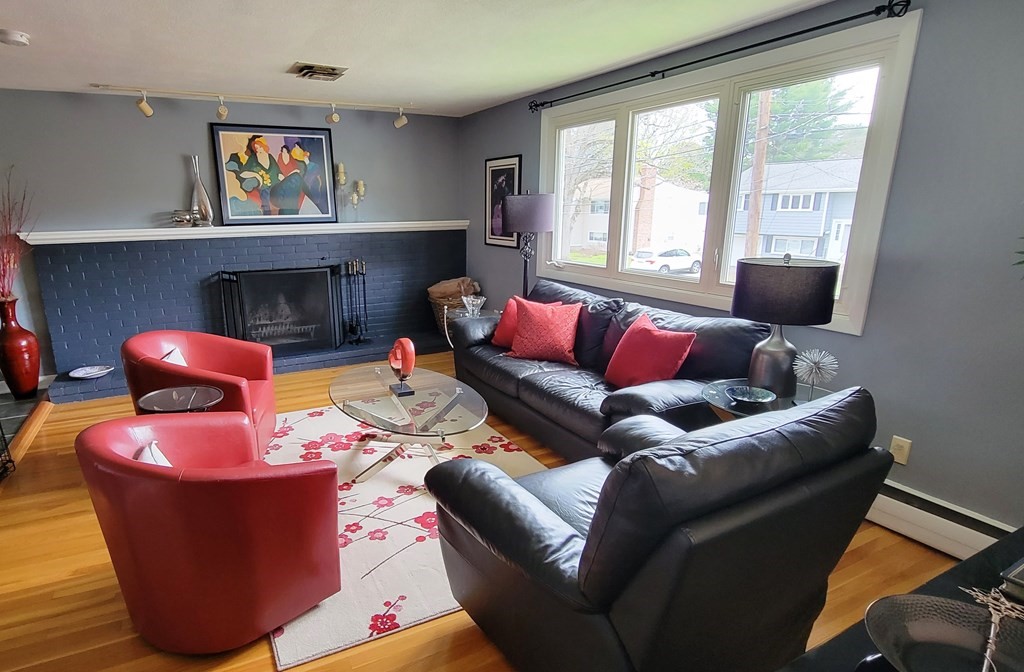 185 Evelyn Road Needham, MA 02494 - Photo 4 of 23 a living room with furniture and a large window